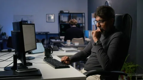 Middle Aged Indian Man Working on Cybersecurity in Modern Office Stock Footage 347294540