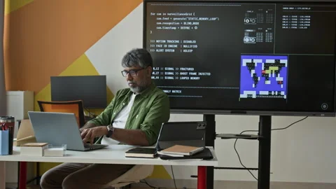 Middle Aged Indian Teacher Programming on Laptop in Classroom 스톡 동영상 342817973