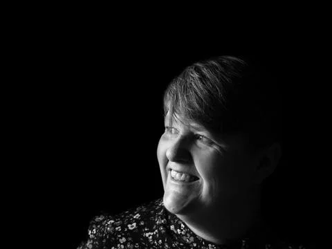 A middle aged lady looking off camera Stock Photos