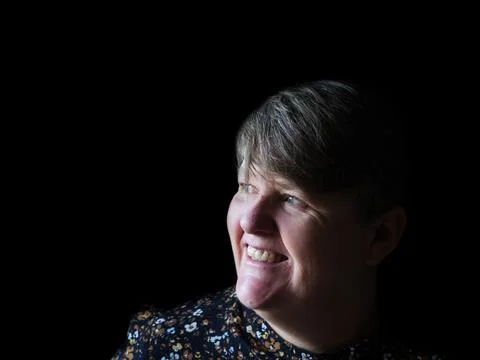 A middle aged lady looking off camera Stock Photos