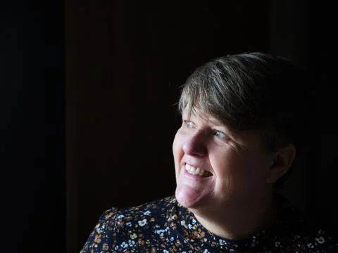 A middle aged lady looking off camera Stock Photos