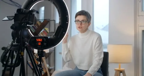 Middle Aged lady records talking video course in studio Stock Footage 240016480