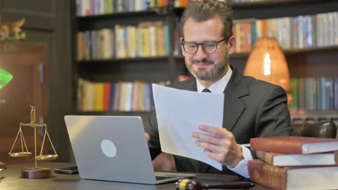 Middle Aged Lawyer Doing Paperwork on Laptop in Office Video stock 294293989