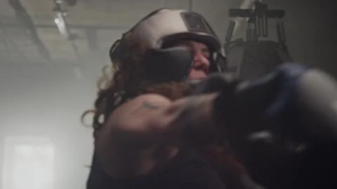 Middle-aged Male Coach Instructing Women Sparring in Ring Stock Footage 340399797