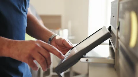 Middle-aged male scientist using a tablet in the laboratory. Close up of a Stock Footage 172373977