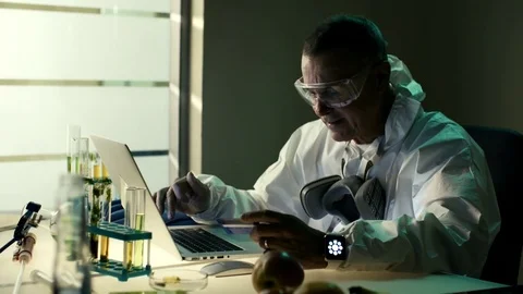 Middle aged male scientist working with computer laptop in modern laboratory Stock Footage 72100565