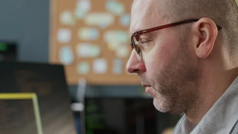 Middle-Aged Male Software Engineer Working on Computer in Modern Office Stock Footage 306830567
