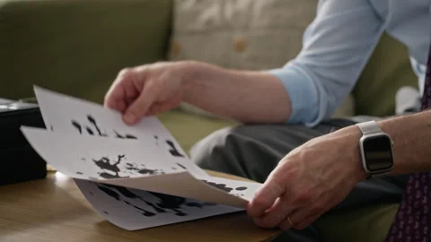 Middle-aged Man Analyzing Inkblot Test during Therapy Session Stock Footage 340630250