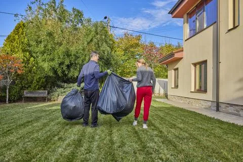 A middle-aged man and his wife work in the garden and do various maintenanc.. Stock Photos