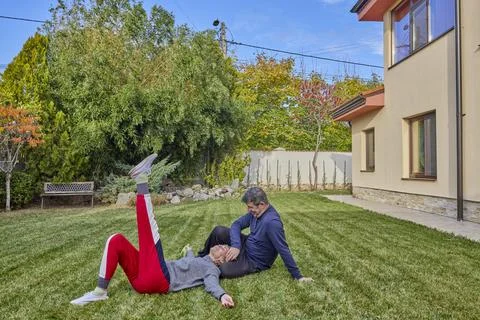 A middle-aged man and his wife work in the garden and do various maintenanc.. Stock Photos