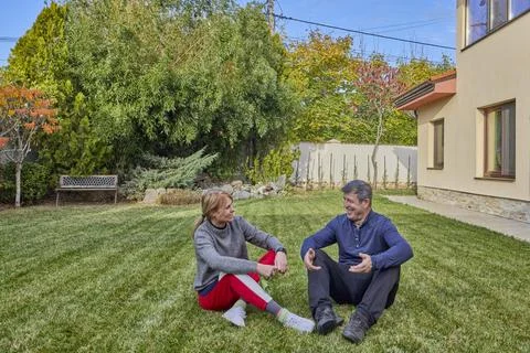 A middle-aged man and his wife work in the garden and do various maintenanc.. Stock Photos