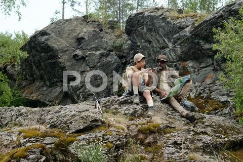 Middle Aged Man and Teenage Boy Fishing Together Outdoors Stock Photos