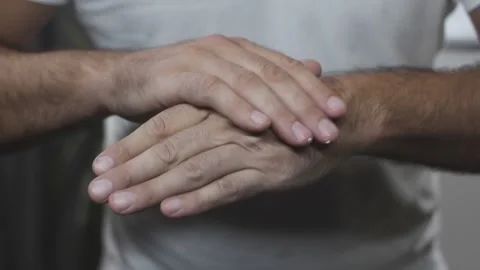 Middle aged man applying moisturising healing cream on hands closeup Stock Footage 342240157