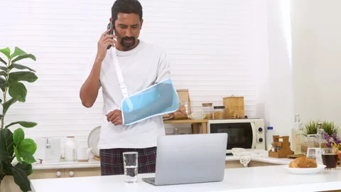 Middle-aged man with arm broken accident talk to insurance agent for compen.. Stock Footage 254669449