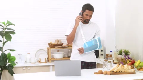 Middle-aged man with arm broken accident talk to insurance agent for compen.. Stock Footage 254749044