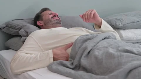 Middle Aged Man with Back Pain while Sleeping in Bed Stock-Footage 287899266
