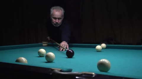Middle-aged man with a beard playing billiards Stock Footage