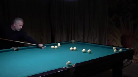 Middle-aged man with a beard playing billiards Stock Footage