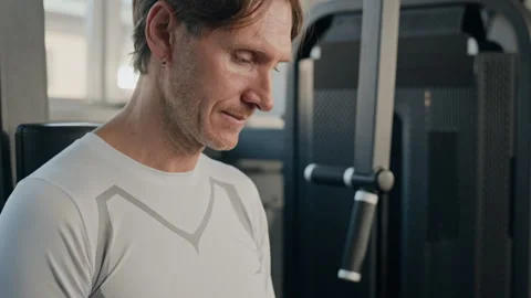 Middle Aged Man Checking Fitness App on Smartphone in Gym Stock Footage 345199081