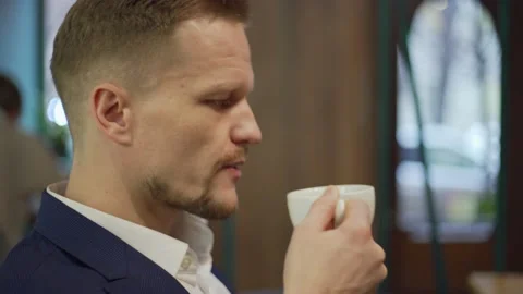 Middle aged man coding on laptop in cafe Video stock 142382696