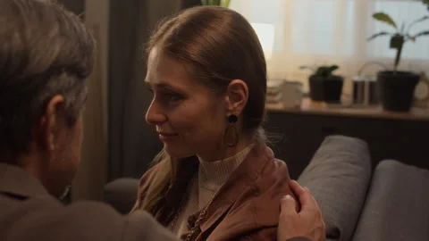 Middle Aged Man Comforting Crying Wife in Living Room Stock Footage 338069199