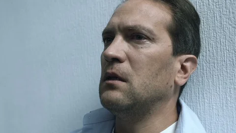 Middle aged man crying rubbing face, need in psychological help, rehabilitation Stock Footage 119299186