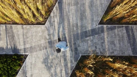 A middle-aged man dancing braidance on the street. Aerial photography of Stock Footage 164912165