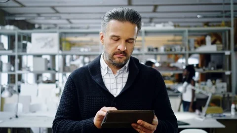 Middle-aged man in design and engineering architecture office Stock Footage 86801685