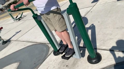 Middle aged man doing exercises on the street. Street workout. Close up Stock Footage 221138581