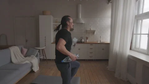 Middle Aged Man Doing Home Fitness No Equipment Exercises Stock Footage 153124492
