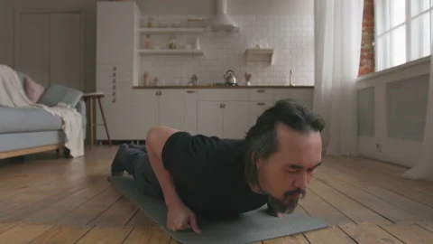 Middle Aged Man Doing Push-ups at Home Stock Footage 151440809