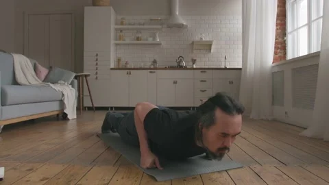 Middle Aged Man Doing Push-ups at Home Stock Footage 153124410