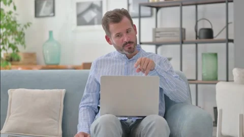 Middle Aged Man Doing Video Chat on Laptop in Lap Stock Footage 287897811