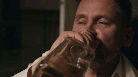 Middle Aged Man Drinking Alcohol from Bottle Suffering from Addiction Stock Footage 344876822
