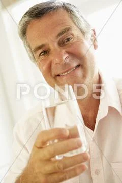Middle Aged Man Drinking A Glass Of Water Stock Photos