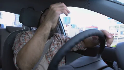 Middle-aged man driving car, suffering elbow pain, ligament sprain, injury Stock Footage 119279089