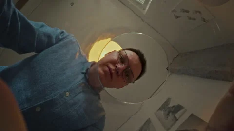 A middle-aged man of European appearance is looking for something in the kit Stock Footage 323725077