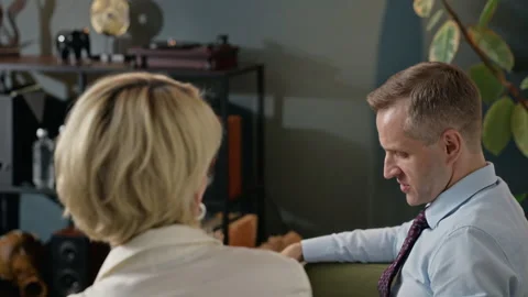 Middle-aged Man Explaining Problems to Female Therapist in Therapy Session Stock Footage 340627447