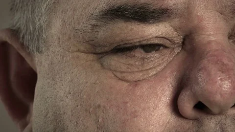 Middle aged man with a fat face: closeup portrait on one eye Stock-Footage 72402713