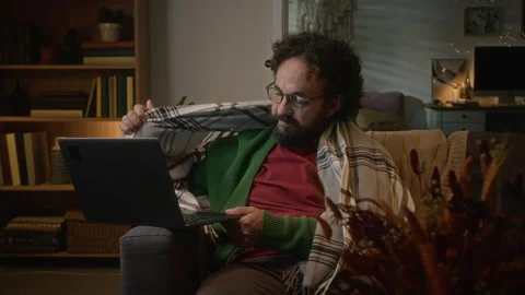 Middle Aged Man Feeling Cold Wrapped in Blanket Working on Laptop Stock Footage 341675289