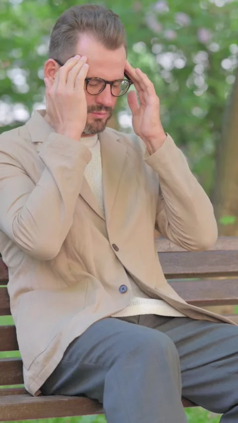 Middle Aged Man Feeling Miserable while Sitting Outdoor on Bench, Vertical Video Stock Footage 319011303