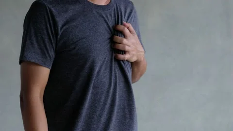 A middle-aged man felt severe chest pain. heart attack caused by stress Stock Footage 188429833