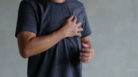 A middle-aged man felt severe chest pain. heart attack caused by stress Stock Footage 188429839