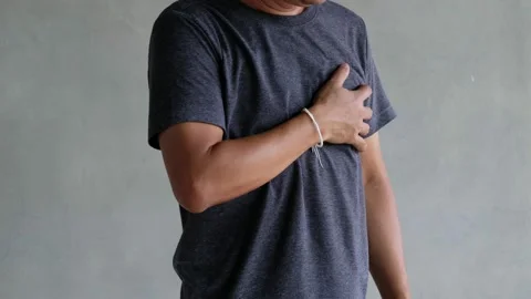 A middle-aged man felt severe chest pain. heart attack caused by stress Stock Footage 188429871