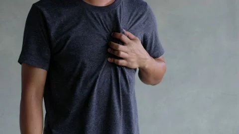 A middle-aged man felt severe chest pain. heart attack caused by stress Stock Footage 188429977