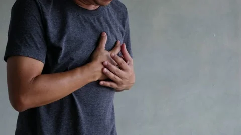 A middle-aged man felt severe chest pain. heart attack caused by stress Stock Footage 188429981