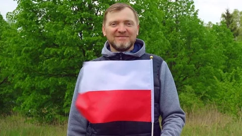 Middle aged man with the flag of Poland. Stock Footage 241939342