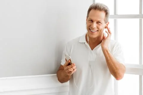 Middle aged man with gadget Foto stock