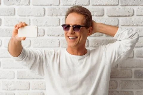 Middle aged man with gadget Stock Photos