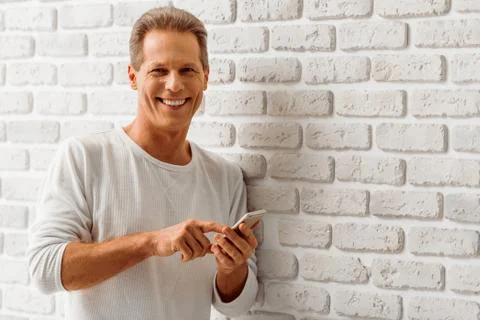 Middle aged man with gadget Foto stock